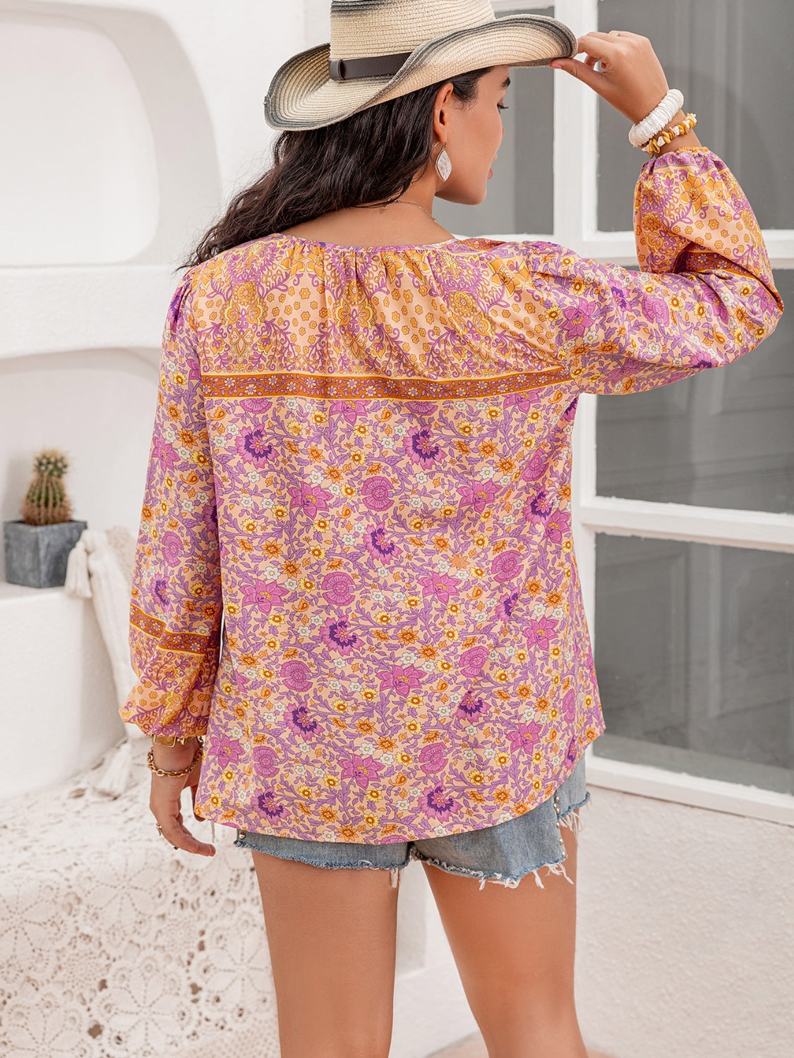 Plus Size Tie Neck Tassel Printed Blouse with Decorative Button.