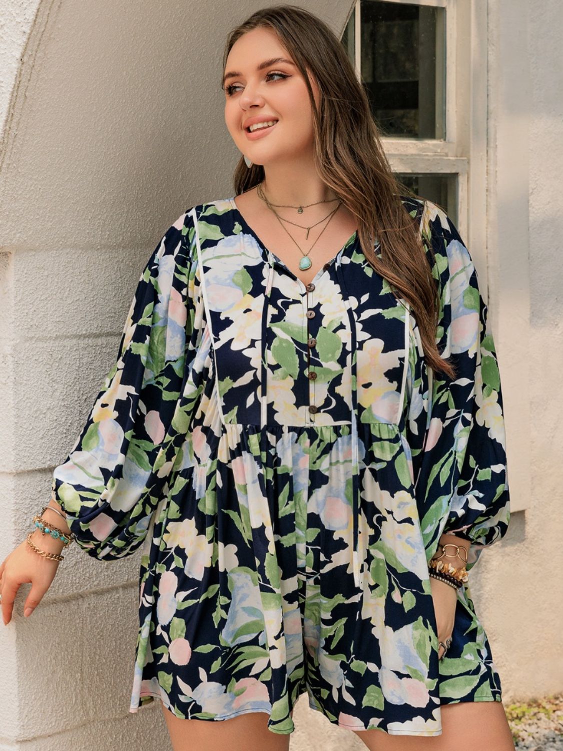 Plus Size Tied Printed Long Sleeve Romper with Decorative Button.