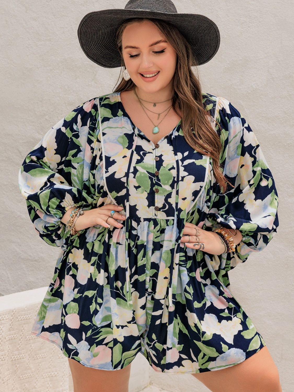 Plus Size Tied Printed Long Sleeve Romper with Decorative Button.