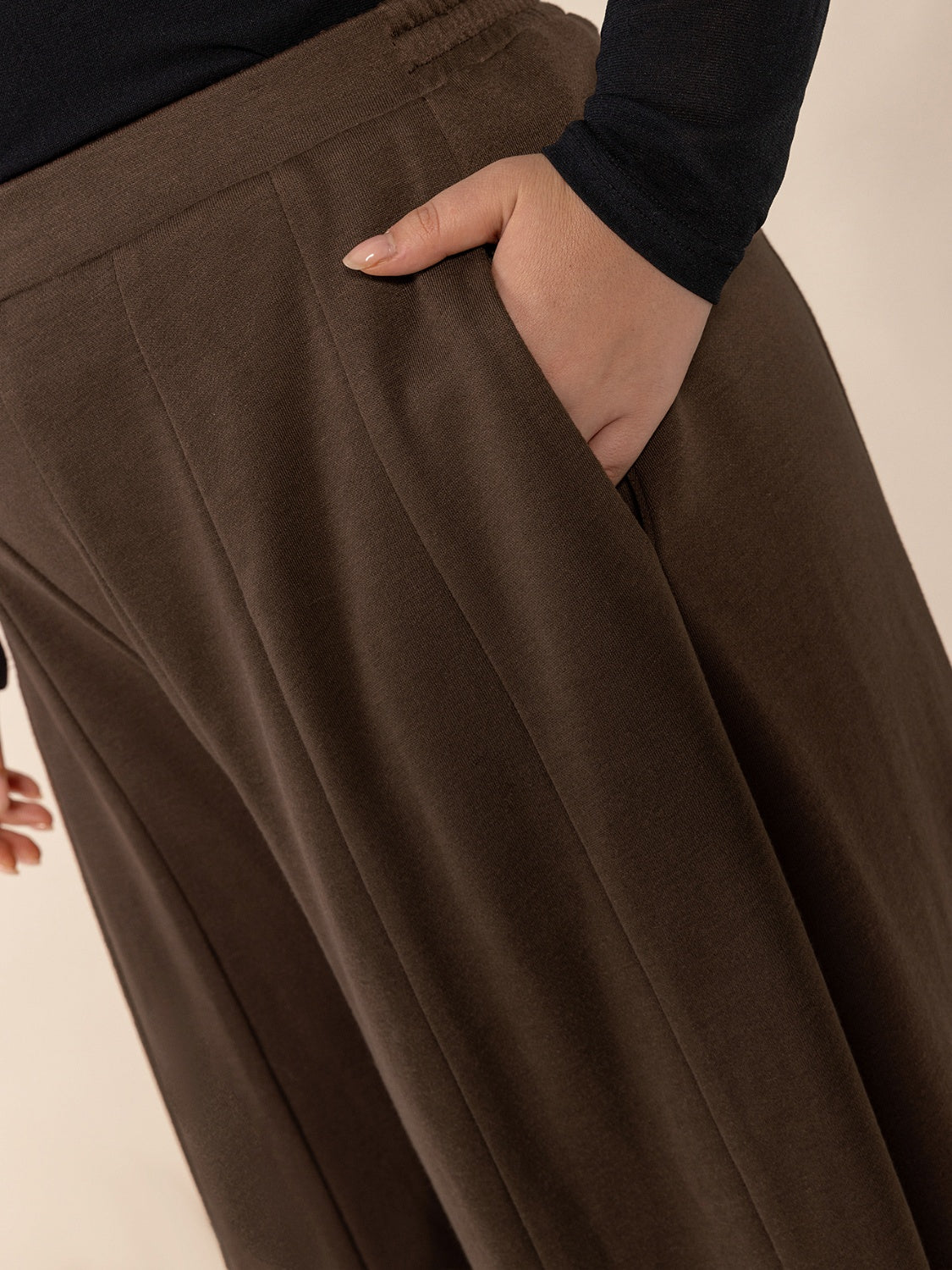 Plus size wide leg pants with pockets and ruched detail, opaque.