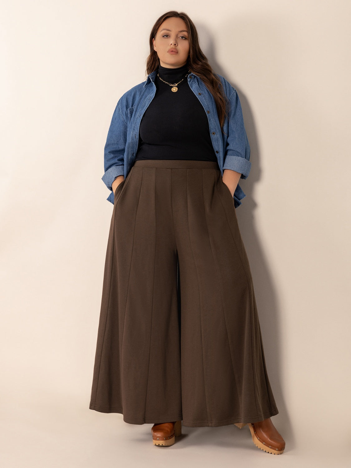Plus size wide leg pants with pockets and ruched detail, opaque.