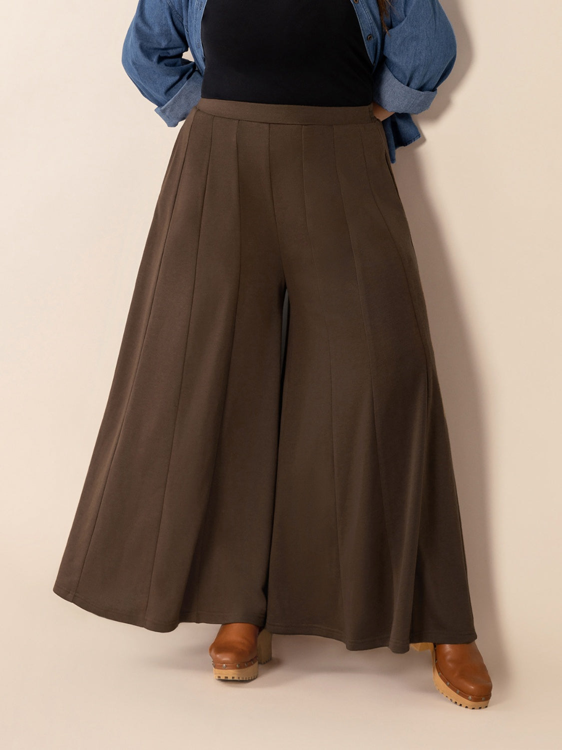 Plus size wide leg pants with pockets and ruched detail, opaque.