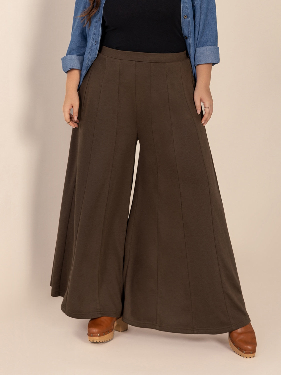 Plus size wide leg pants with pockets and ruched detail, opaque.