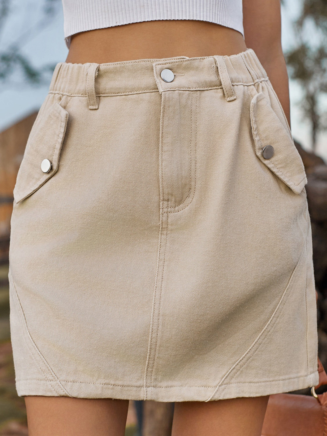 Pocketed Buttoned Mini Denim Skirt.