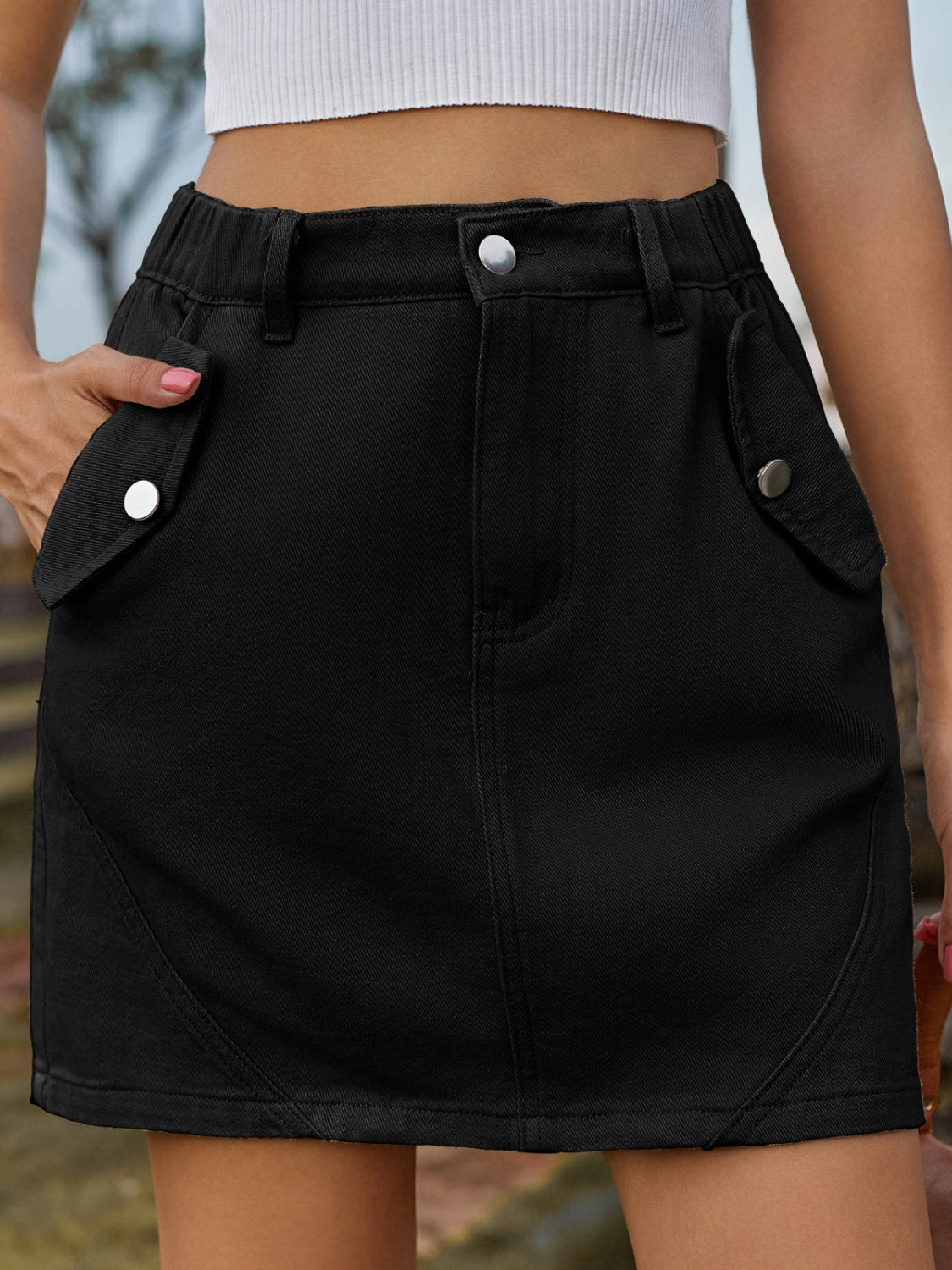 Pocketed Buttoned Mini Denim Skirt.