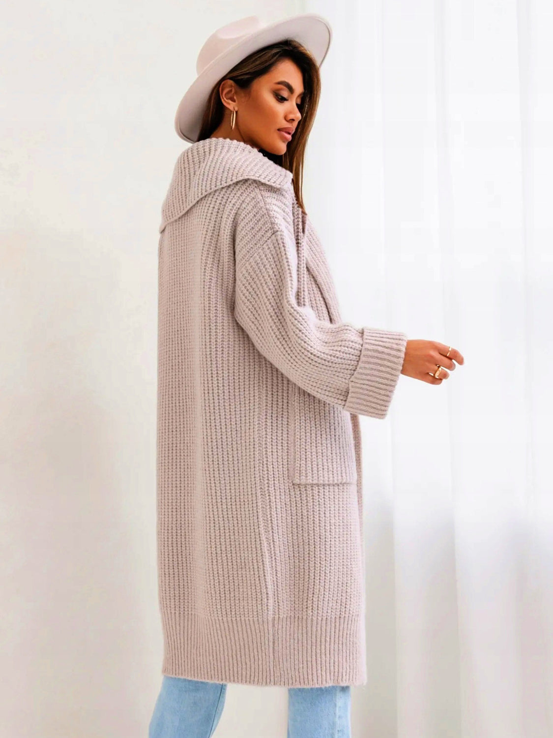 Pocketed collared neck dropped shoulder cardigan.