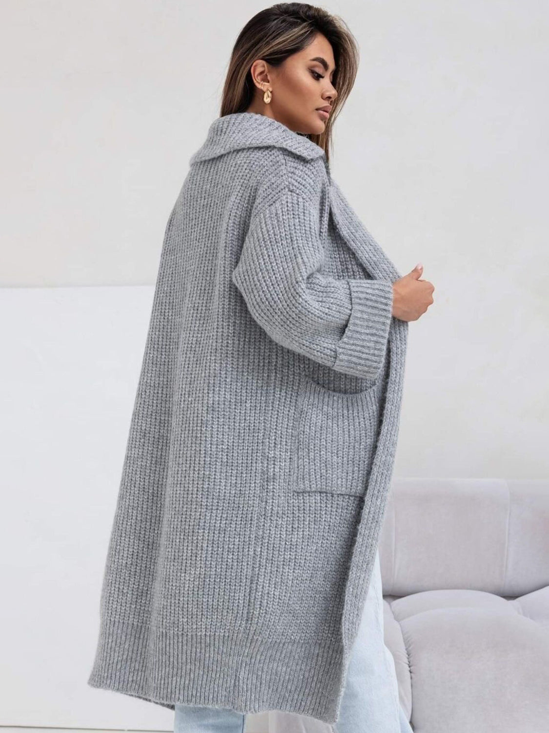 Pocketed collared neck dropped shoulder cardigan.