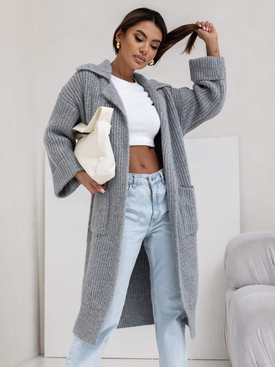 Pocketed collared neck dropped shoulder cardigan.