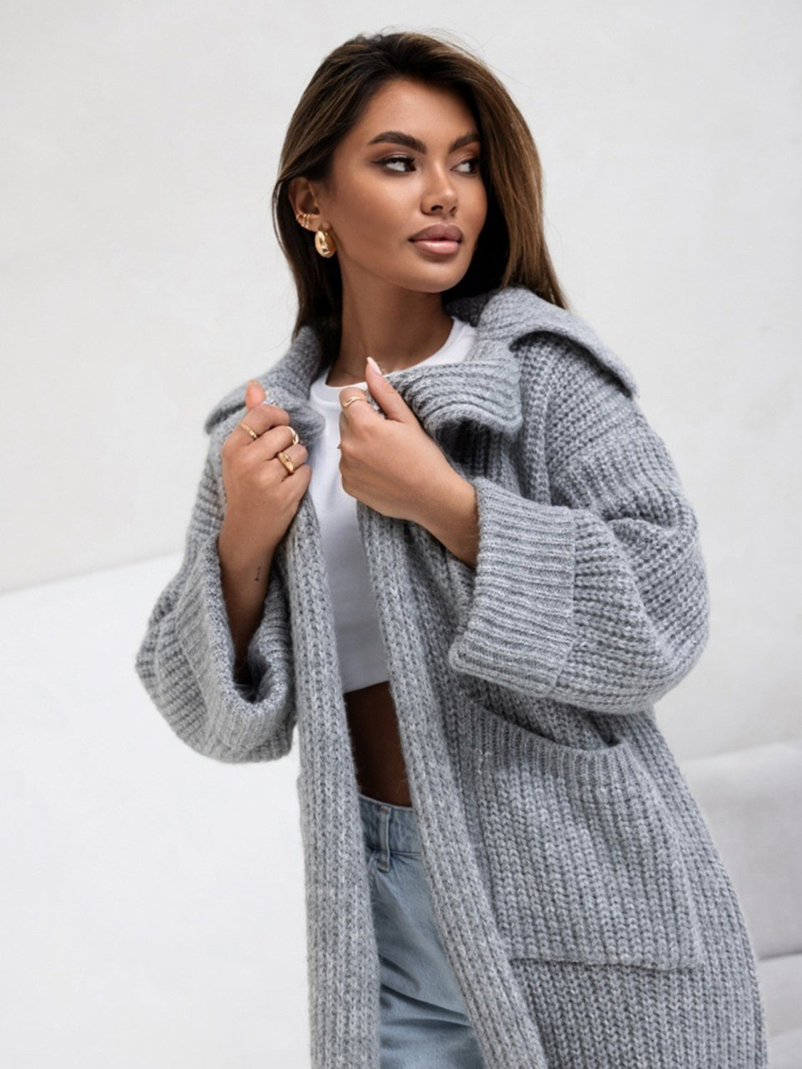 Pocketed collared neck dropped shoulder cardigan.