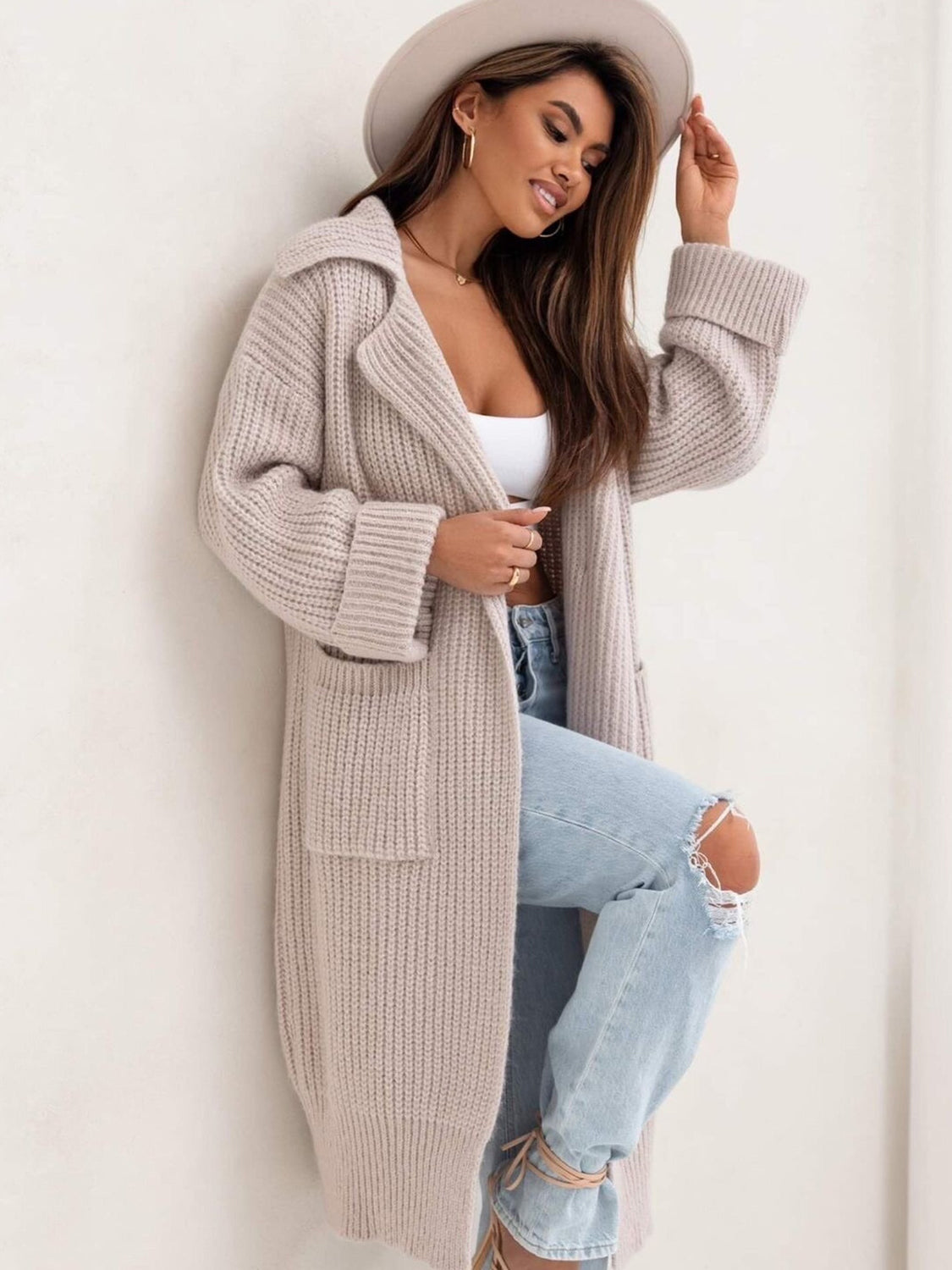 Pocketed collared neck dropped shoulder cardigan.