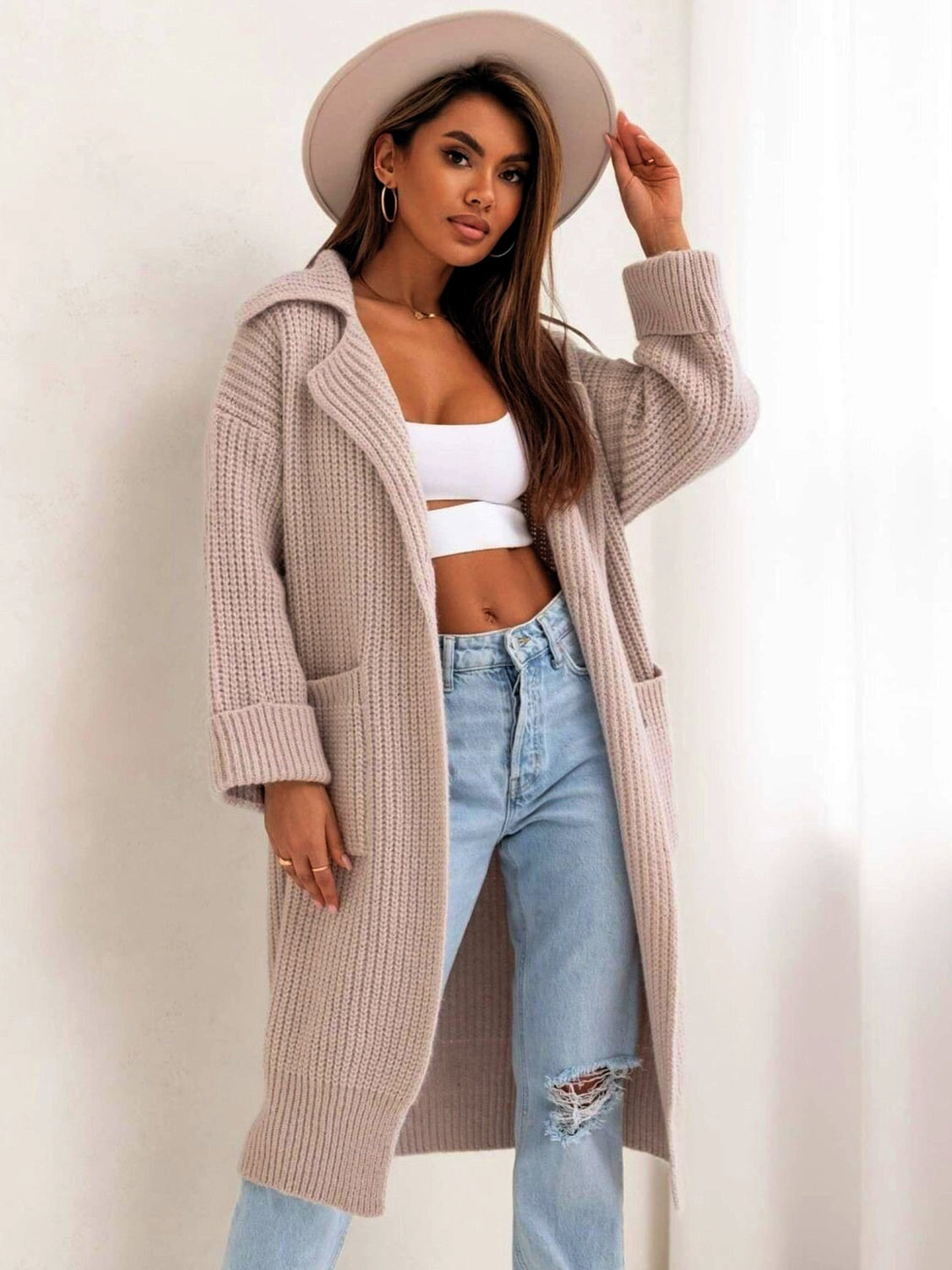 Pocketed collared neck dropped shoulder cardigan.