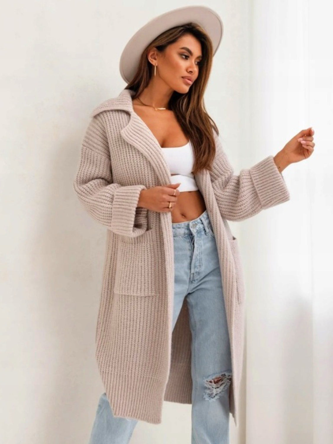 Pocketed collared neck dropped shoulder cardigan.