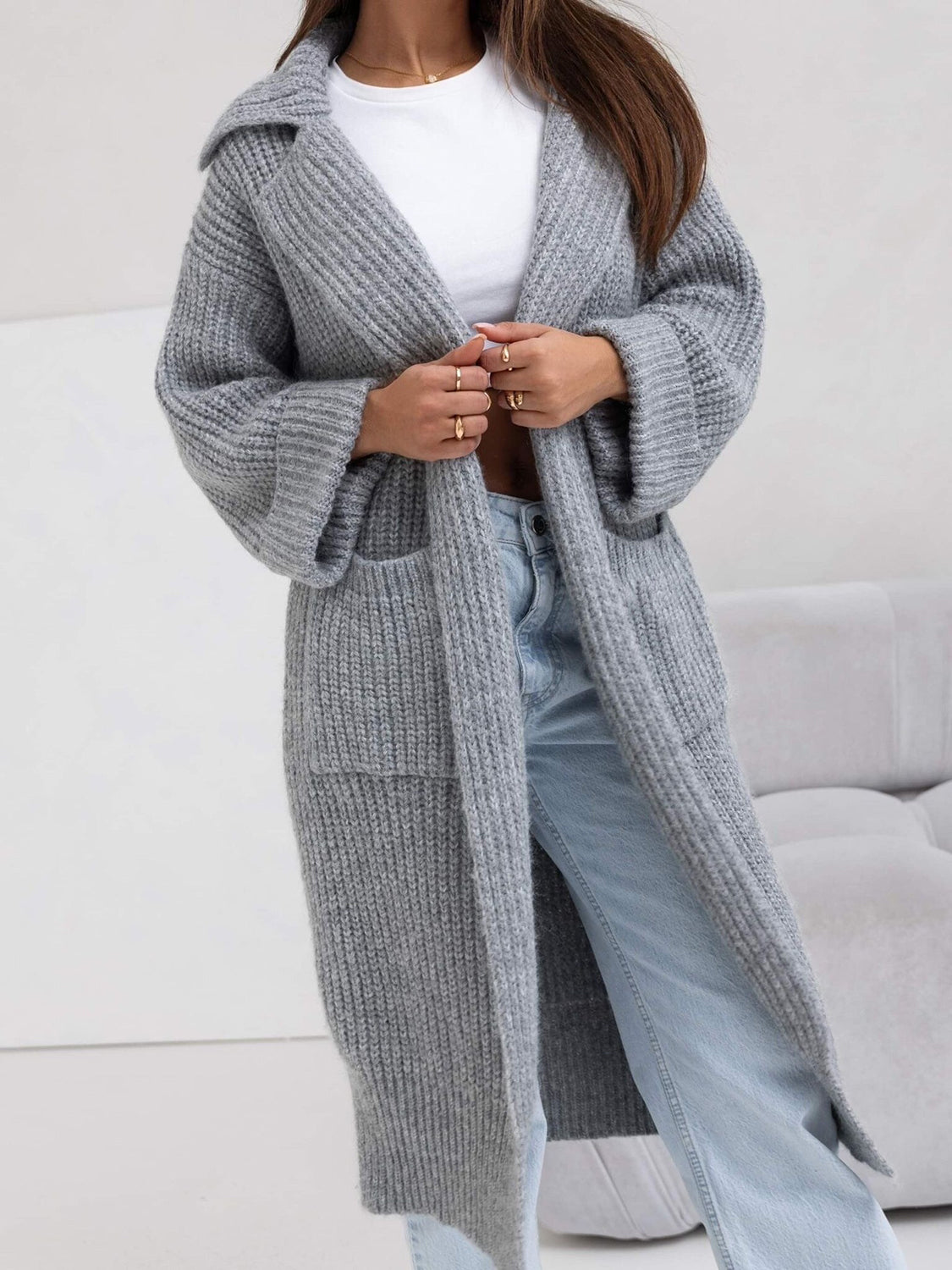 Pocketed collared neck dropped shoulder cardigan.