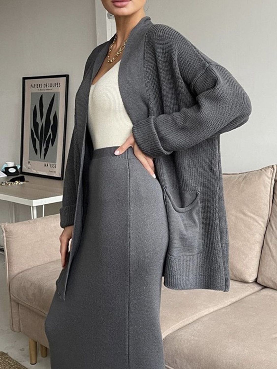Two-piece set: pocketed long sleeve cardigan and matching skirt sweater set.