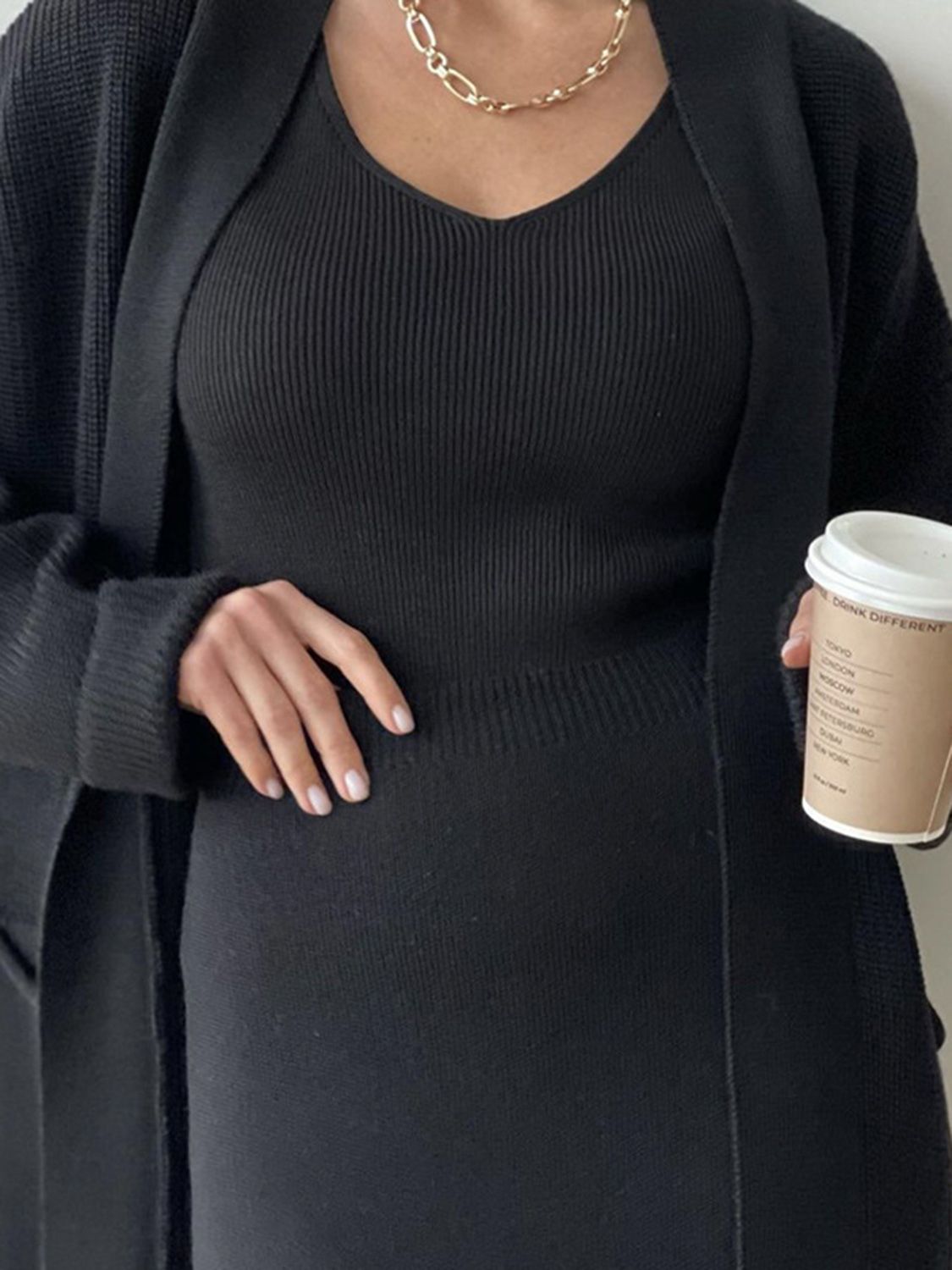 Two-piece set: pocketed long sleeve cardigan and matching skirt sweater set.