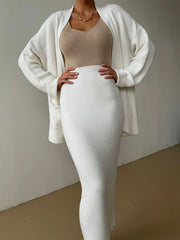 Two-piece set: pocketed long sleeve cardigan and matching skirt sweater set.
