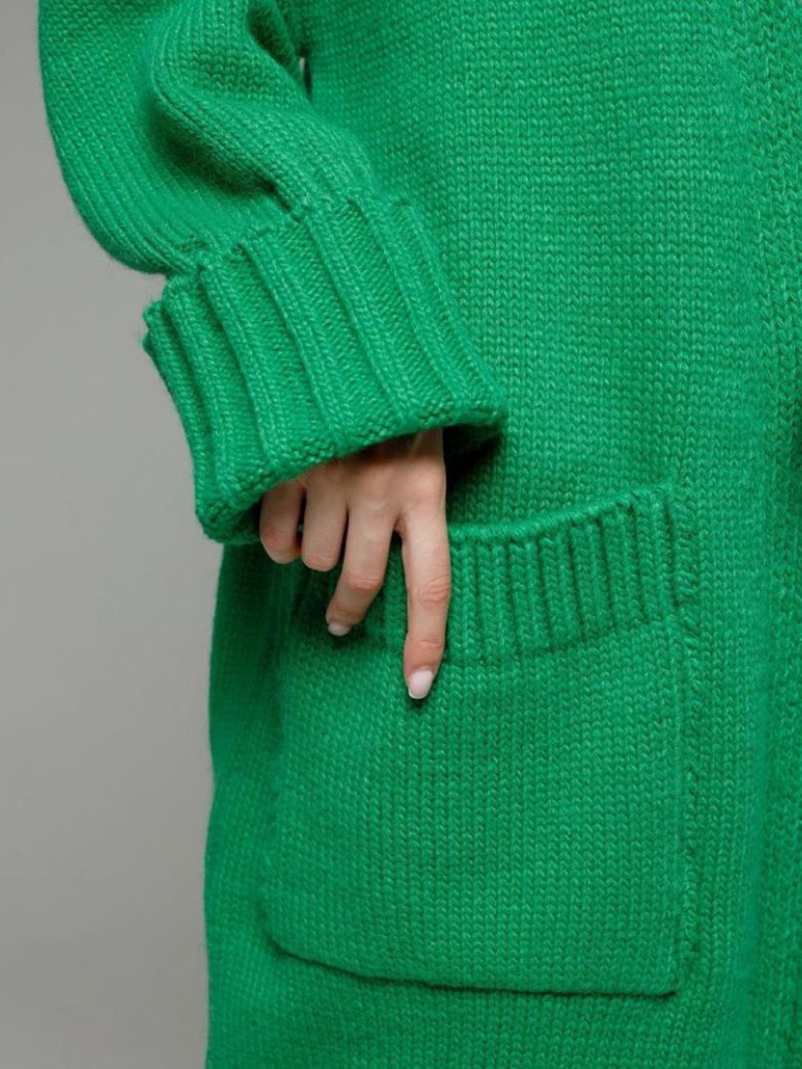 Pocketed open front dropped shoulder cardigan.