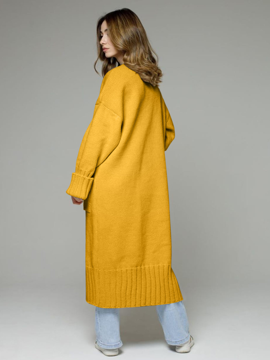 Pocketed open front dropped shoulder cardigan.
