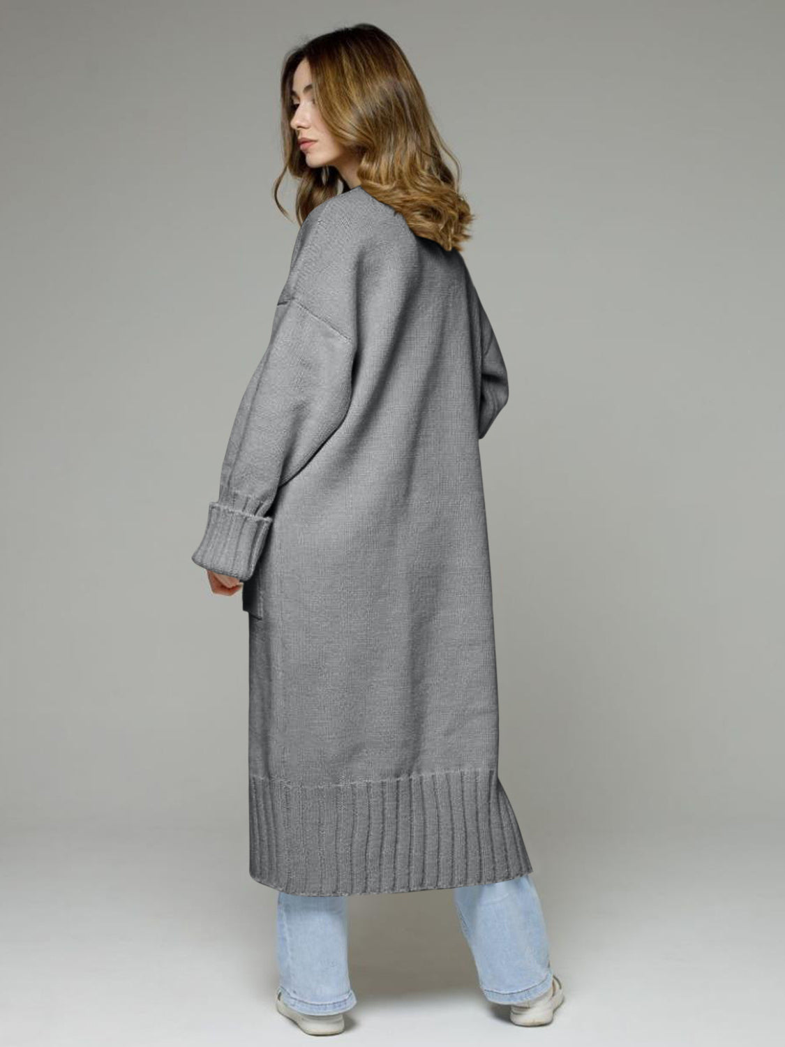 Pocketed open front dropped shoulder cardigan.