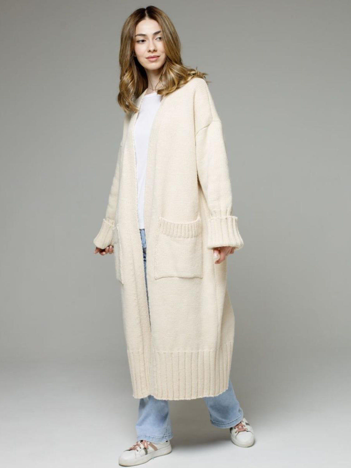 Pocketed open front dropped shoulder cardigan.