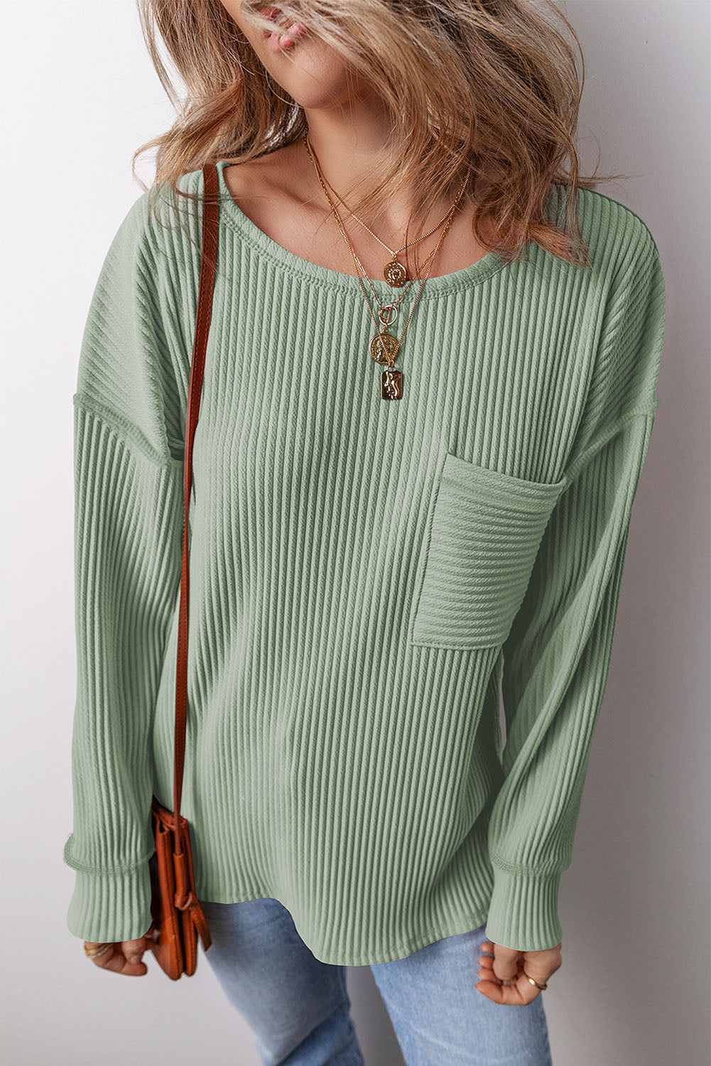 Pocketed Round Neck Long Sleeve Top.
