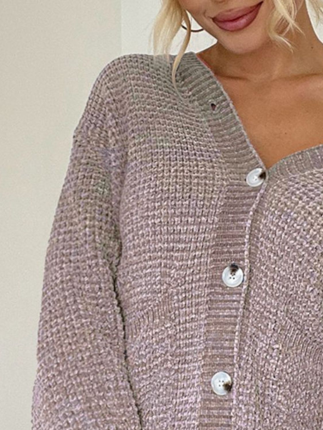 Pocketed V-neck button up cardigan.