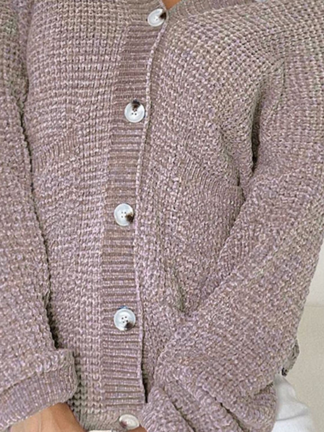 Pocketed V-neck button up cardigan.