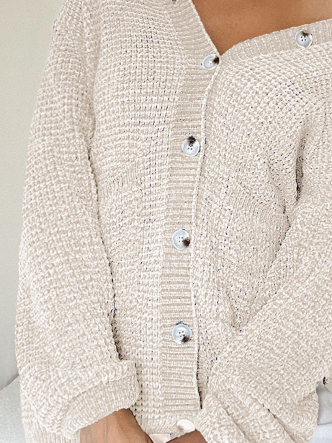 Pocketed V-neck button up cardigan.