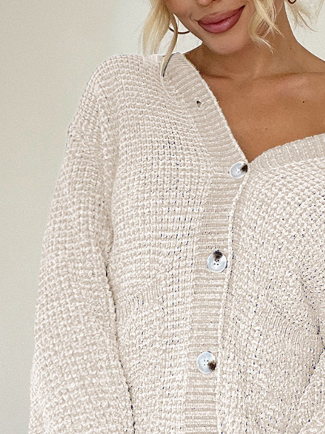 Pocketed V-neck button up cardigan.