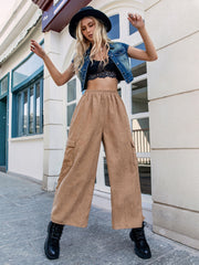 Pocketed wide leg elastic waist pants, opaque.