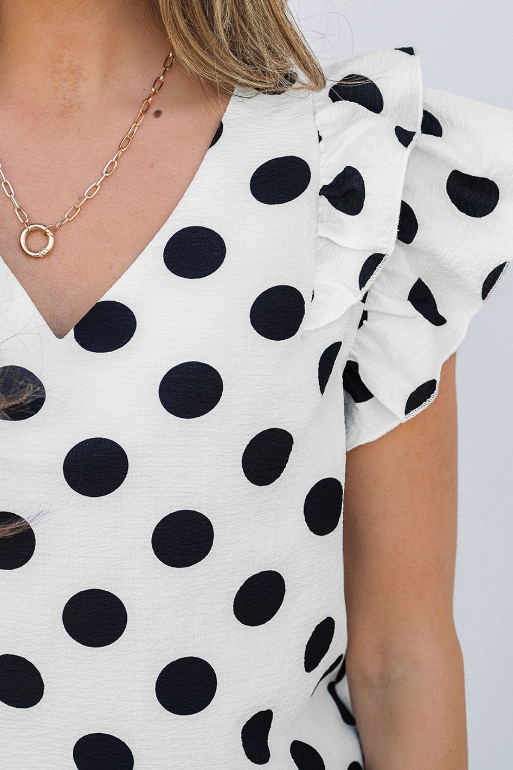 Polka Dot Ruffled Cap Sleeve V Neck Blouse.