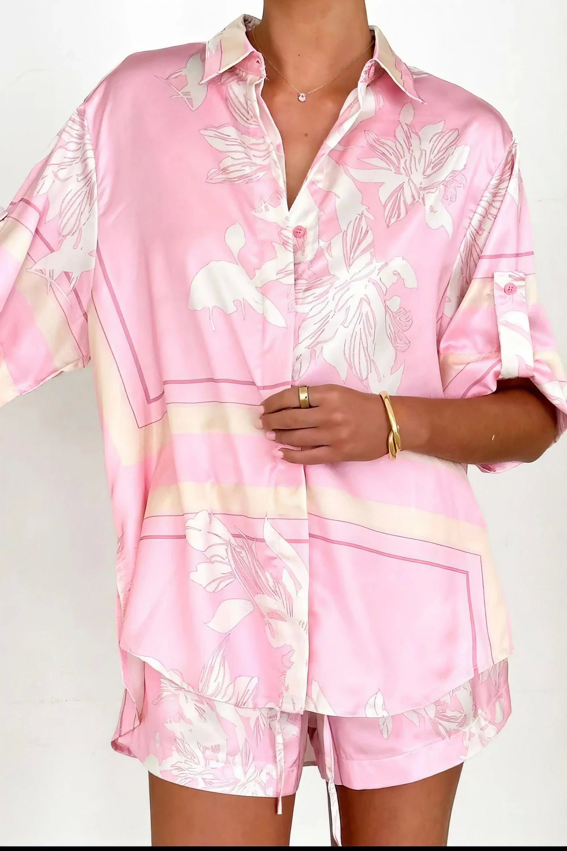 printed collared neck top and shorts set, polished women's two-piece outfit, classic style summer fashion, comfortable printed set, buttoned top, tailored shorts, sophisticated casual wear