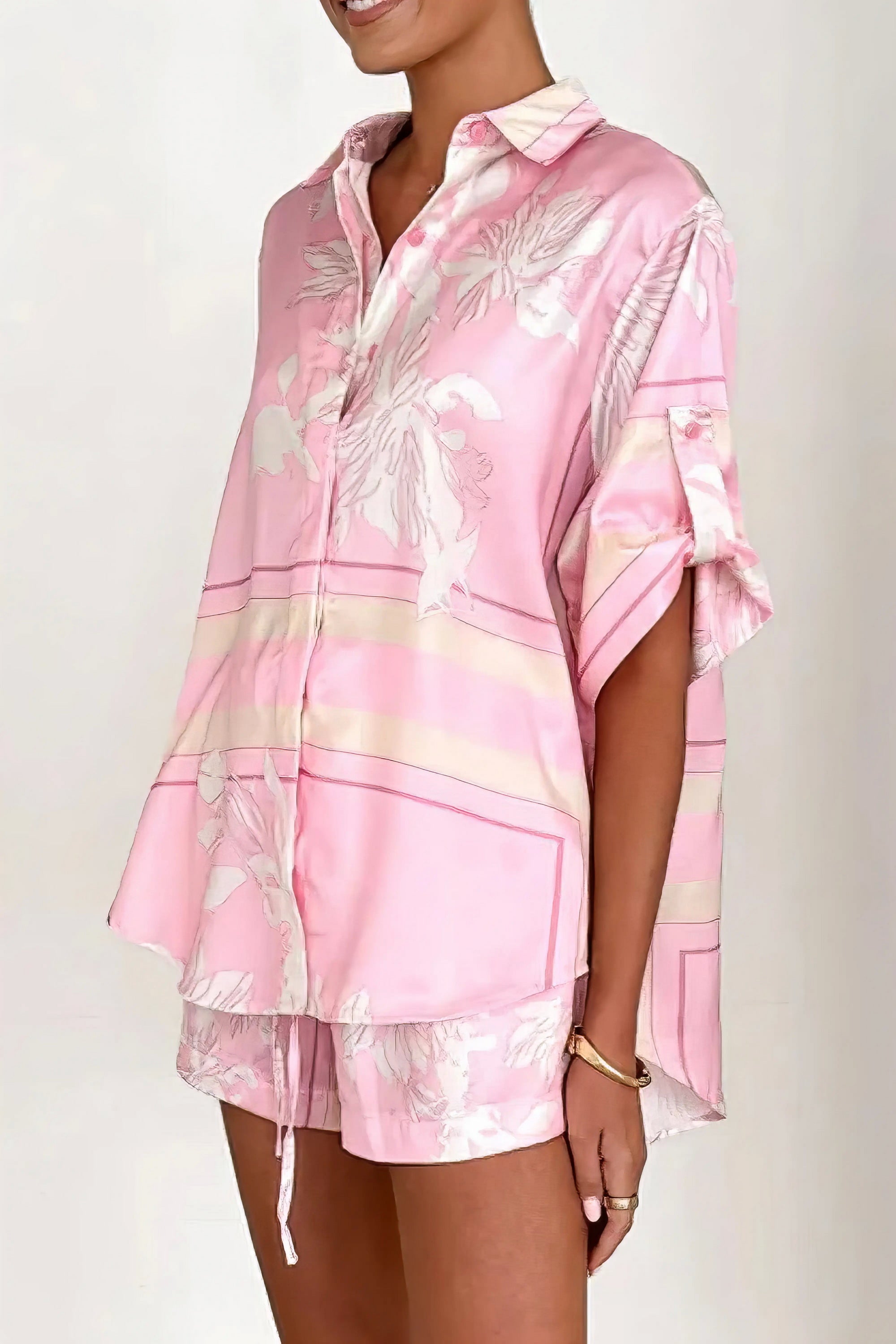 printed collared neck top and shorts set, polished women's two-piece outfit, classic style summer fashion, comfortable printed set, buttoned top, tailored shorts, sophisticated casual wear