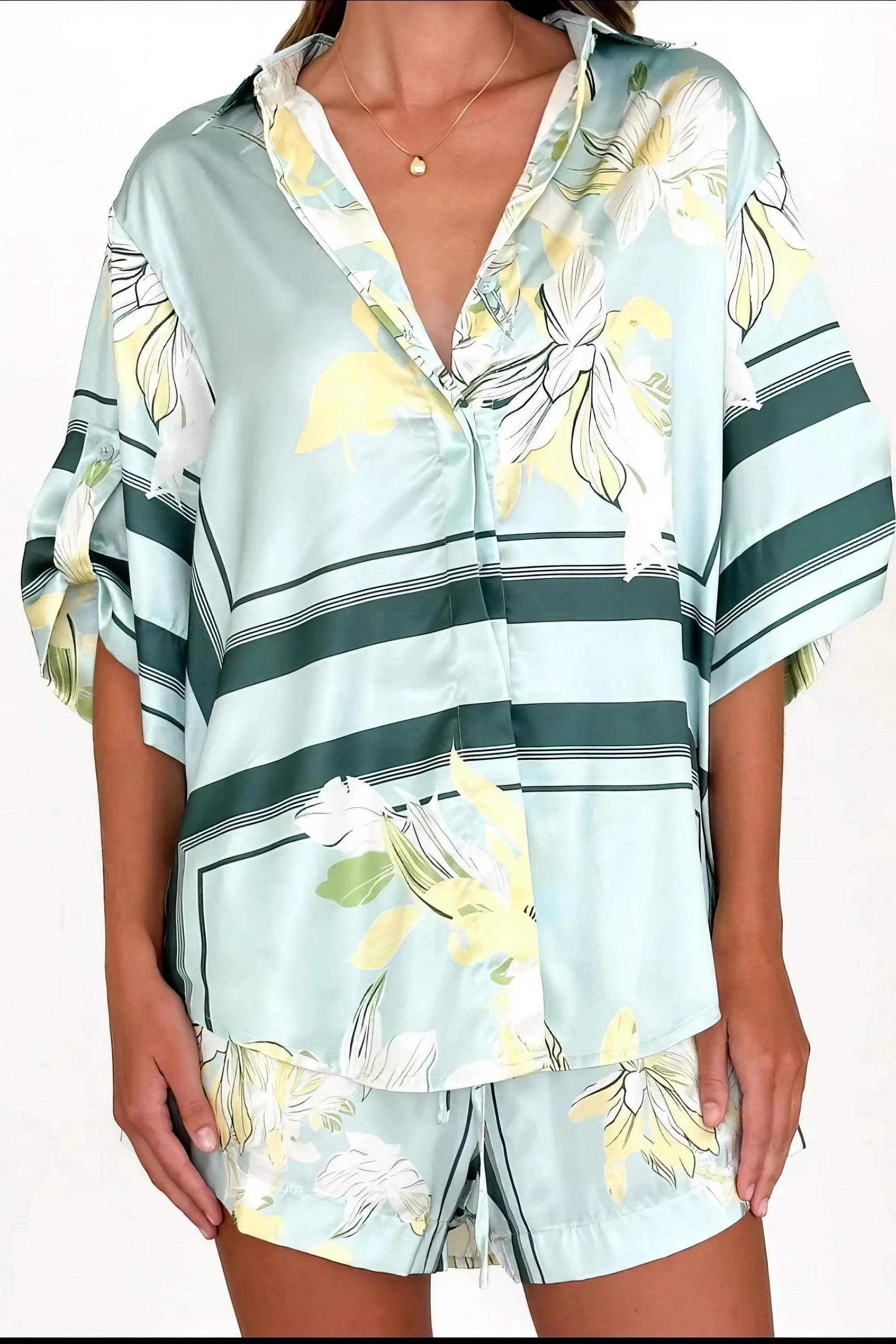 printed collared neck top and shorts set, polished women's two-piece outfit, classic style summer fashion, comfortable printed set, buttoned top, tailored shorts, sophisticated casual wear