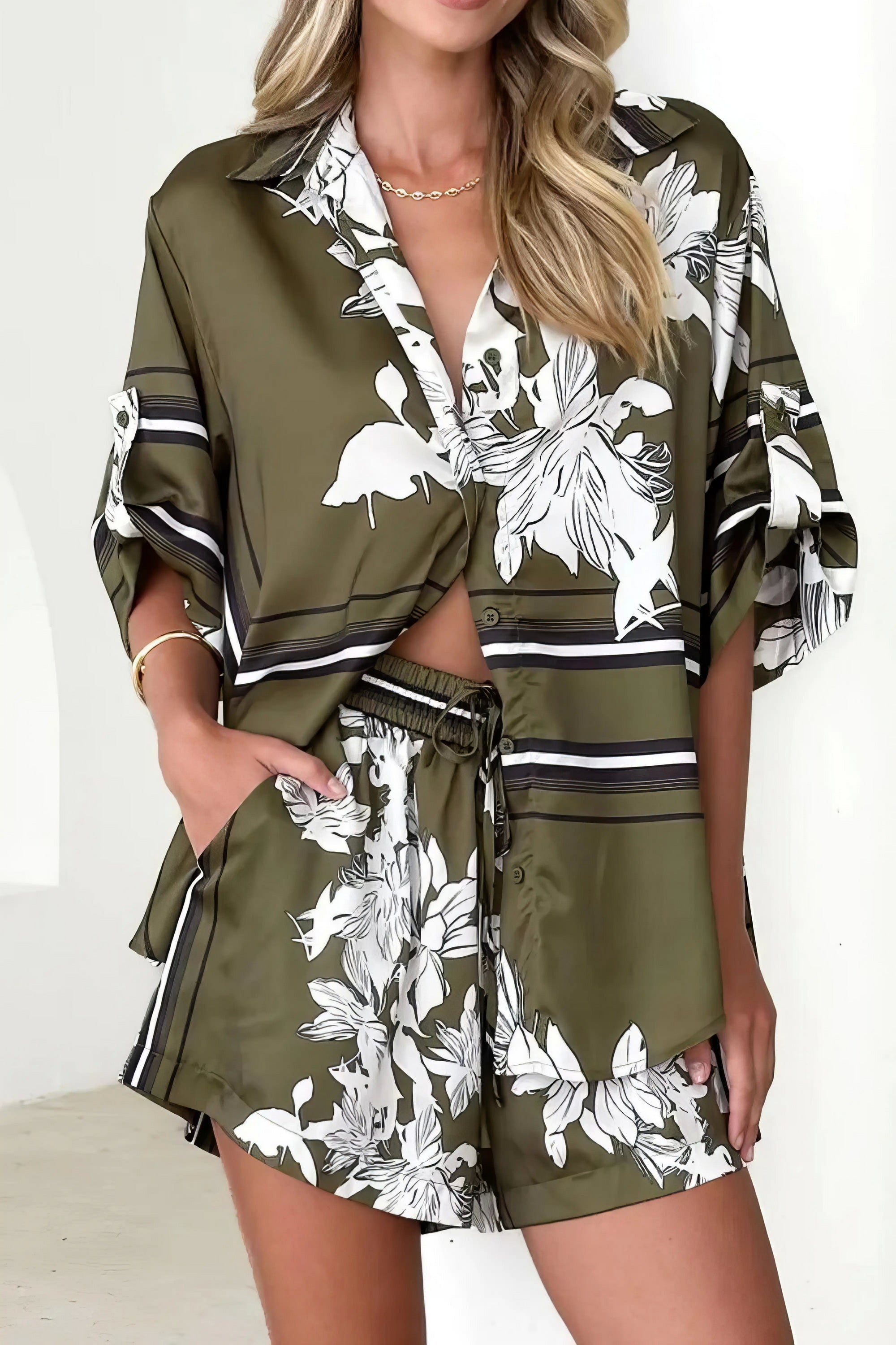 printed collared neck top and shorts set, polished women's two-piece outfit, classic style summer fashion, comfortable printed set, buttoned top, tailored shorts, sophisticated casual wear