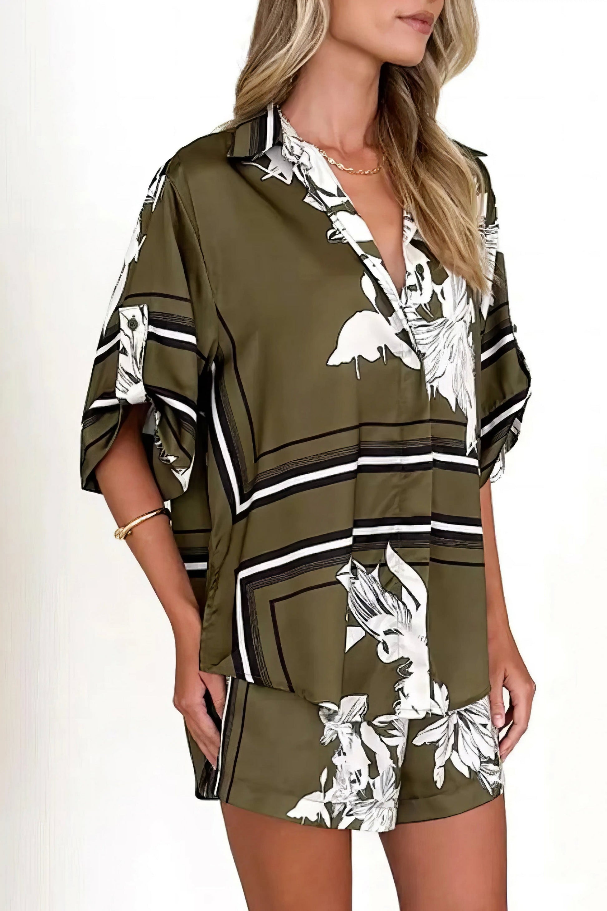 printed collared neck top and shorts set, polished women's two-piece outfit, classic style summer fashion, comfortable printed set, buttoned top, tailored shorts, sophisticated casual wear