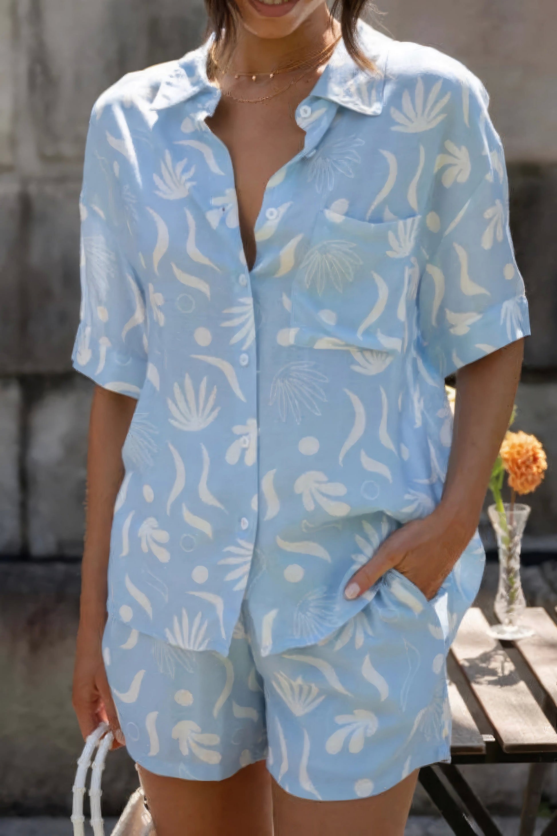 Printed collared neck top and shorts set, women's polished two-piece outfit, stylish printed set, buttoned top, practical pockets, non-stretch polyester spandex blend, ideal for a refined casual look