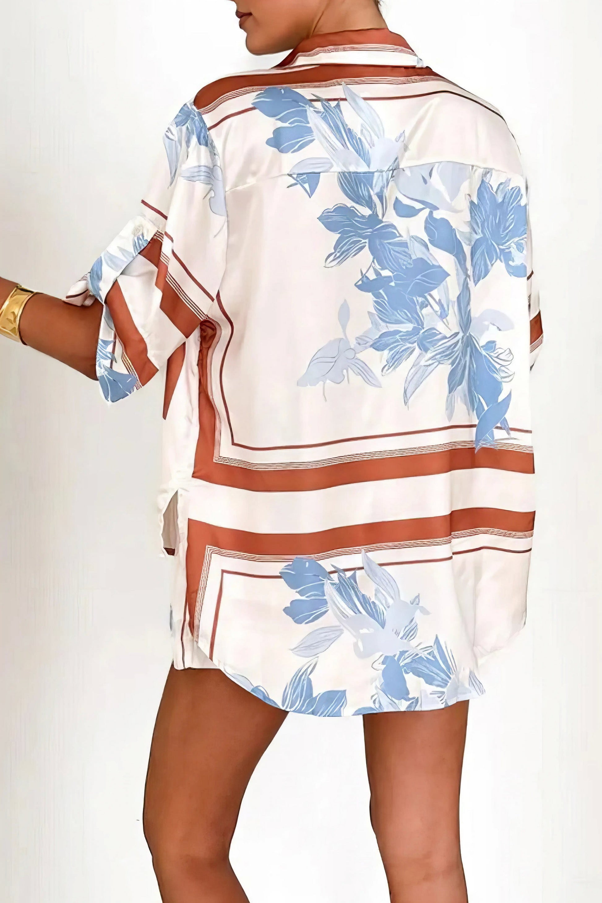 printed collared neck top and shorts set, polished women's two-piece outfit, classic style summer fashion, comfortable printed set, buttoned top, tailored shorts, sophisticated casual wear
