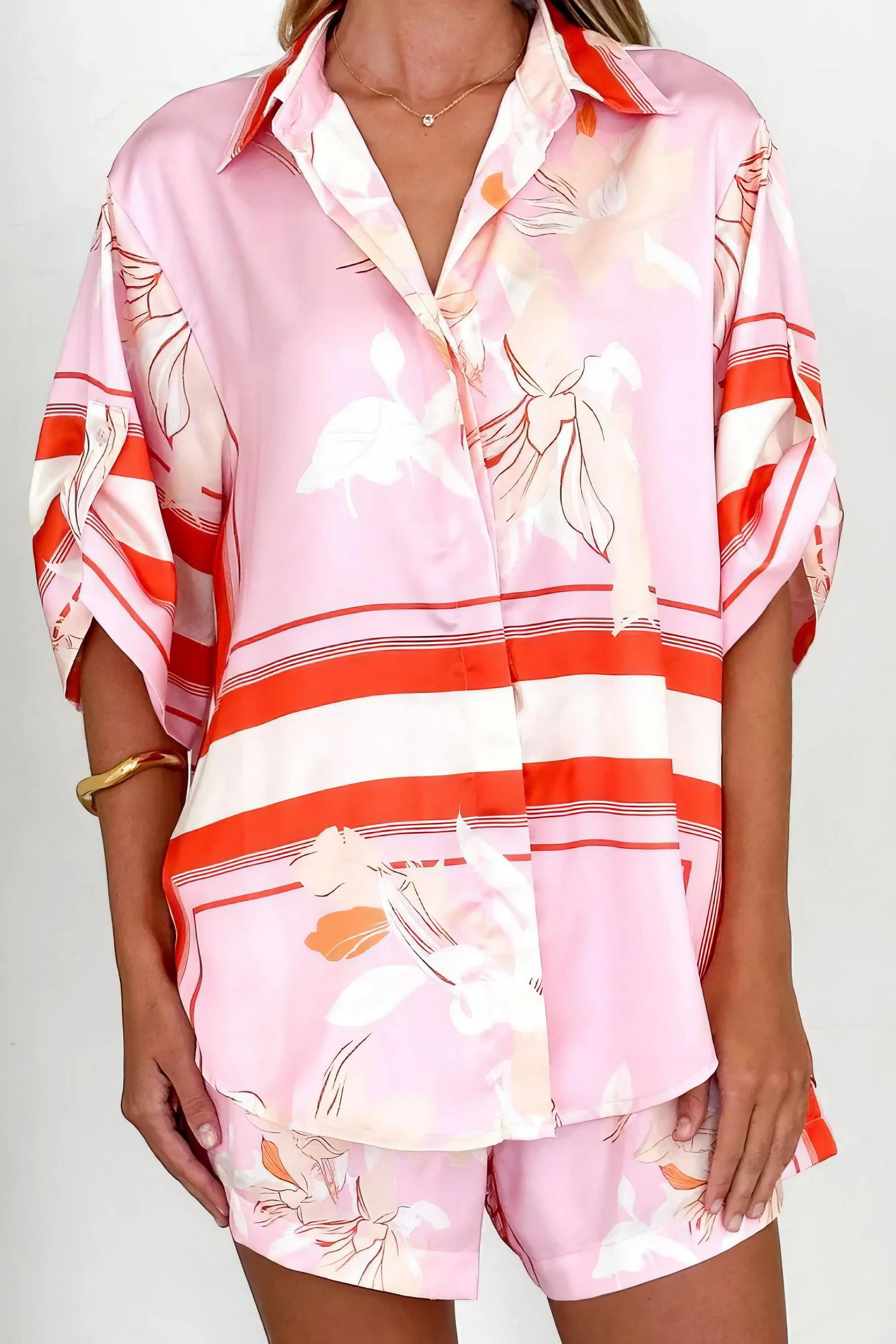 printed collared neck top and shorts set, polished women's two-piece outfit, classic style summer fashion, comfortable printed set, buttoned top, tailored shorts, sophisticated casual wear