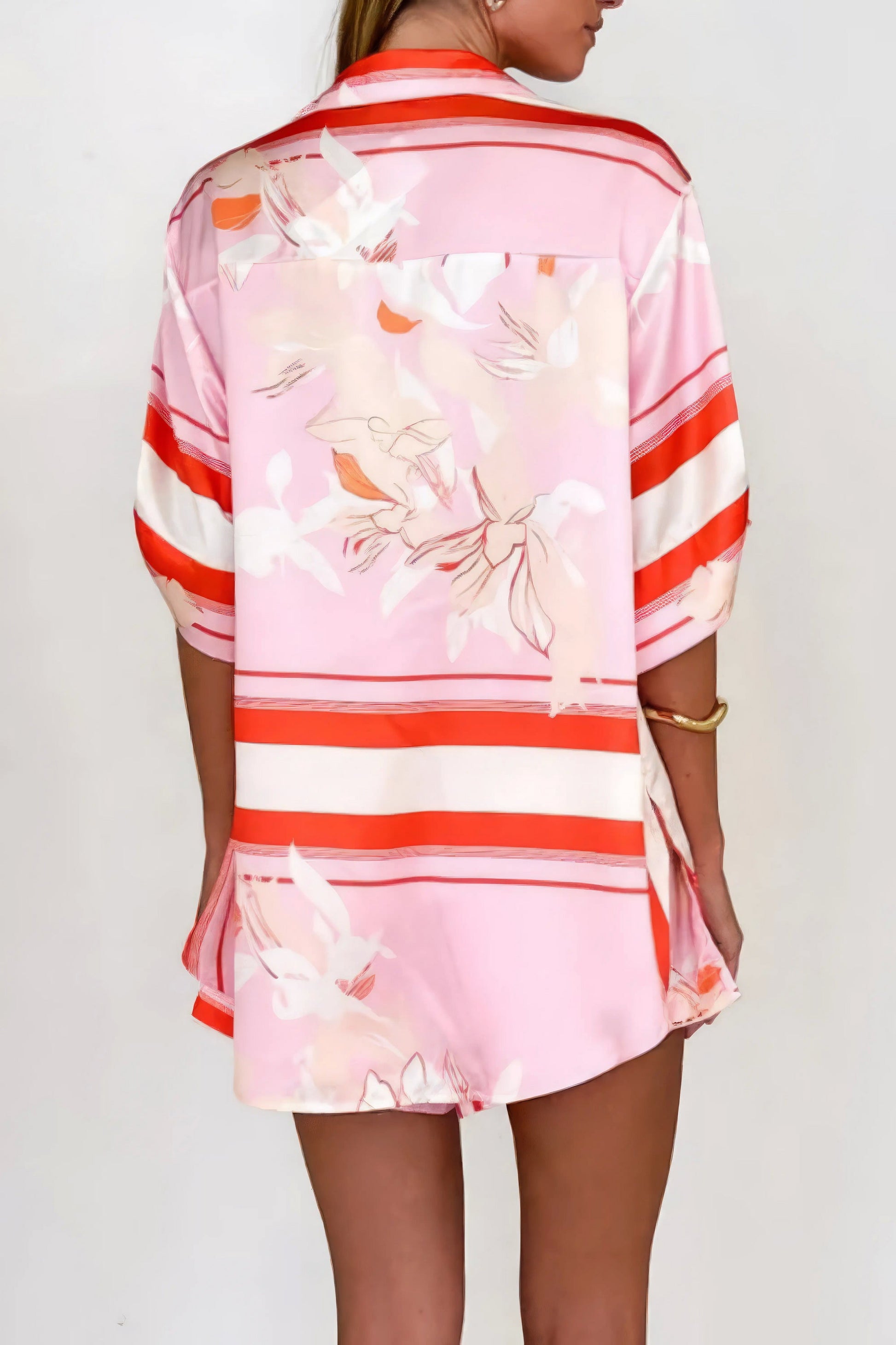printed collared neck top and shorts set, polished women's two-piece outfit, classic style summer fashion, comfortable printed set, buttoned top, tailored shorts, sophisticated casual wear
