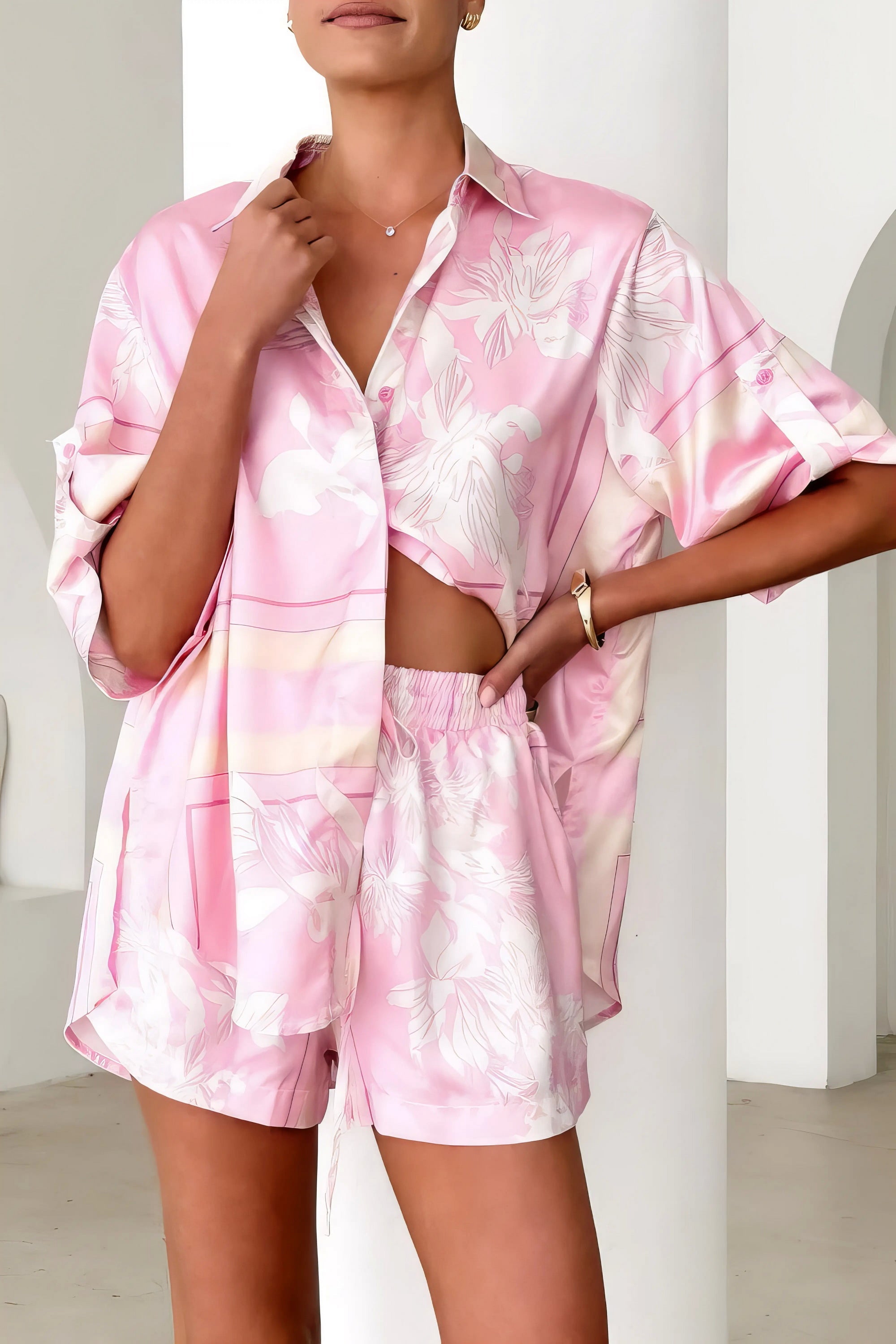 printed collared neck top and shorts set, polished women's two-piece outfit, classic style summer fashion, comfortable printed set, buttoned top, tailored shorts, sophisticated casual wear