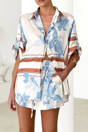 printed collared neck top and shorts set, polished women's two-piece outfit, classic style summer fashion, comfortable printed set, buttoned top, tailored shorts, sophisticated casual wear