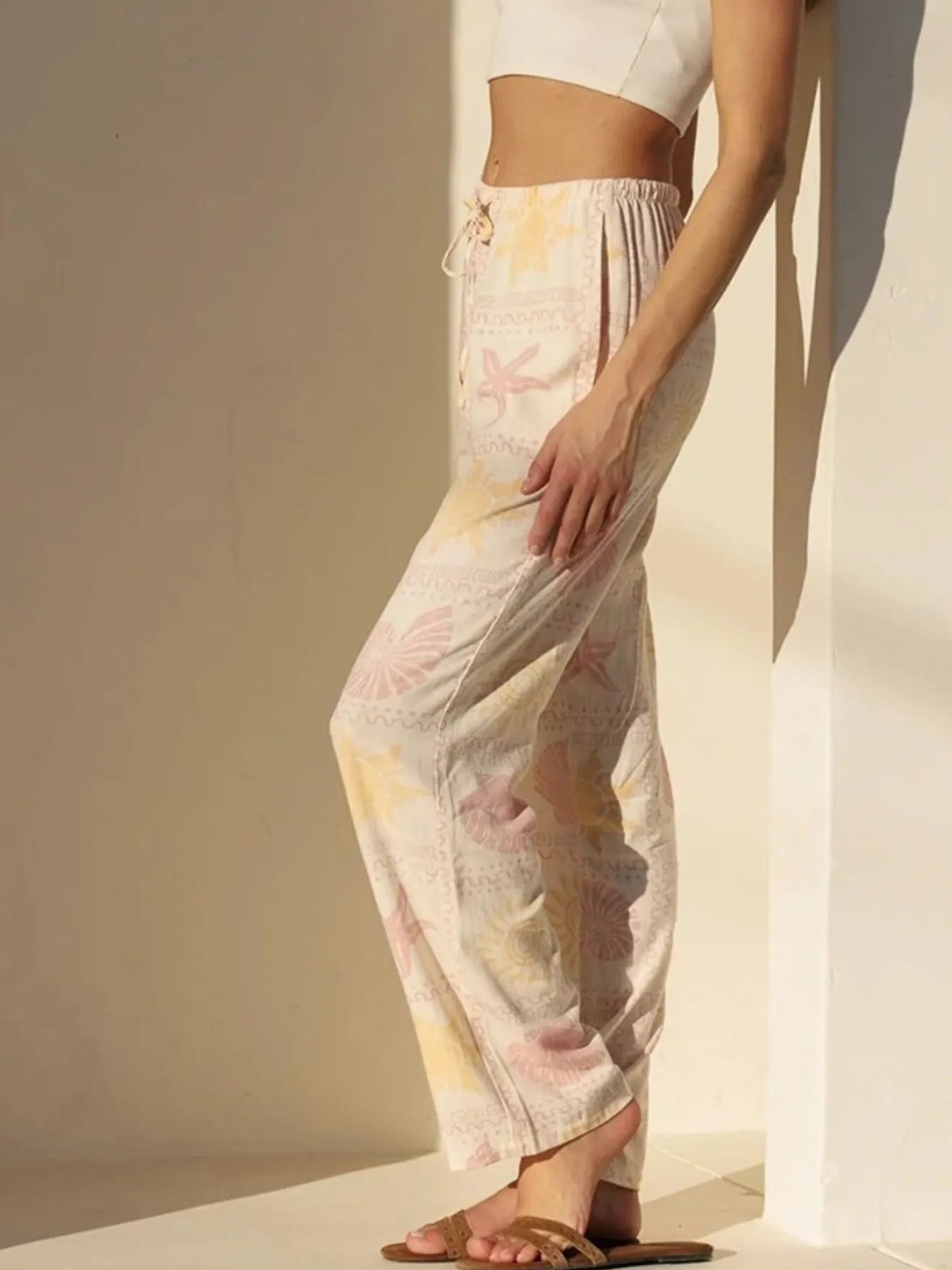 Printed drawstring straight pants with pockets.