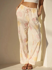 Printed drawstring straight pants with pockets.