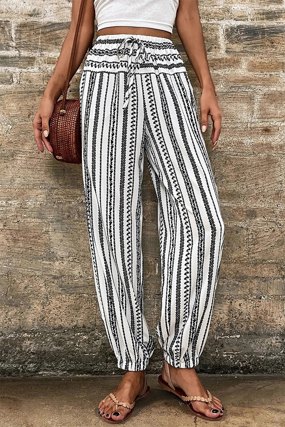 Printed elastic waist pants with drawstring, opaque.
