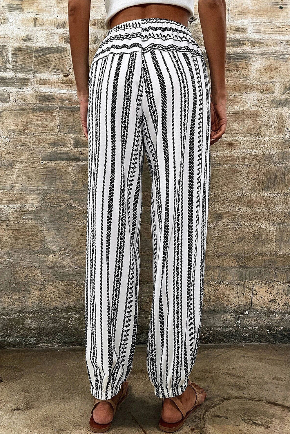Printed elastic waist pants with drawstring, opaque.