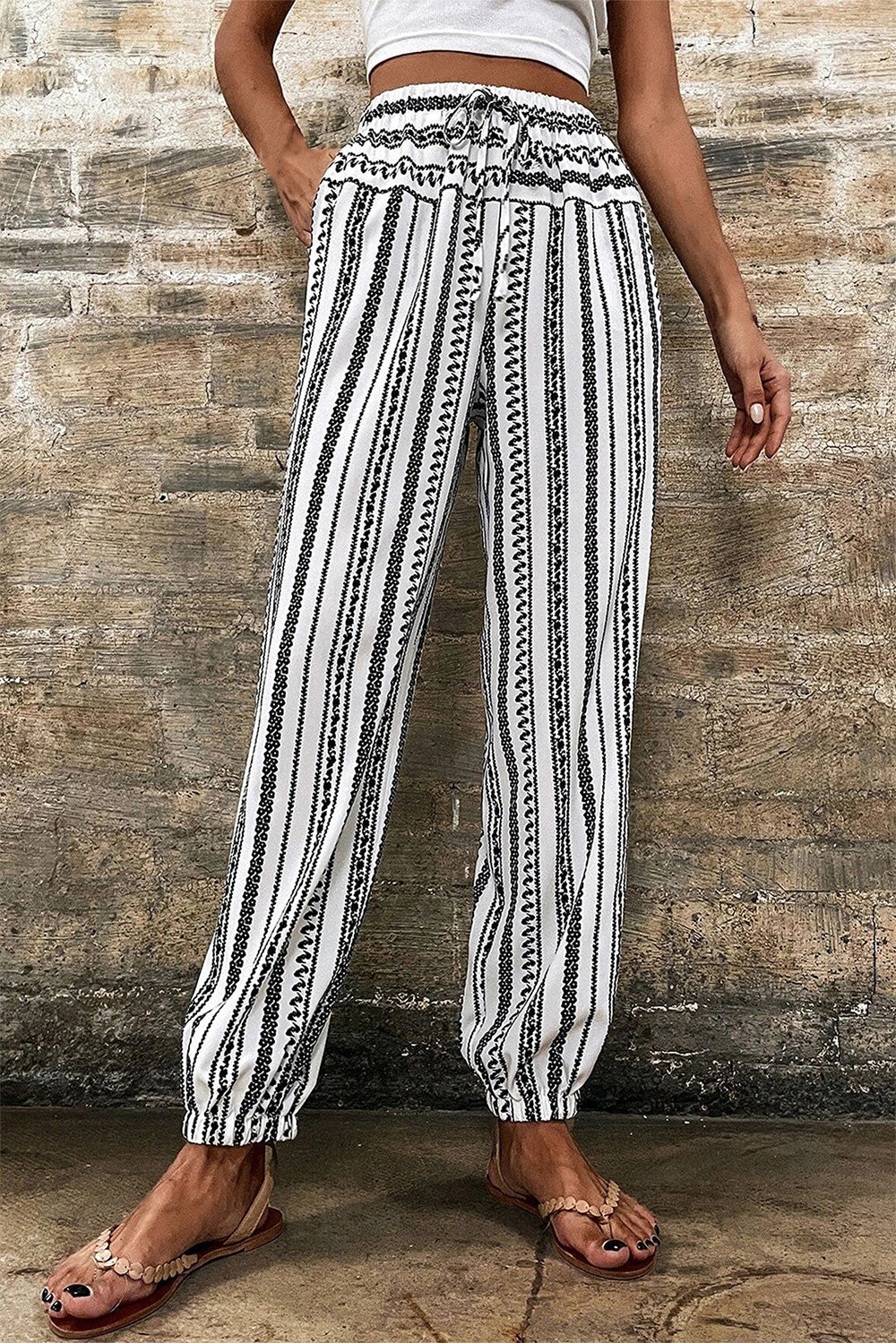 Printed elastic waist pants with drawstring, opaque.