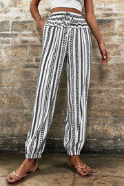 Printed elastic waist pants with drawstring, opaque.