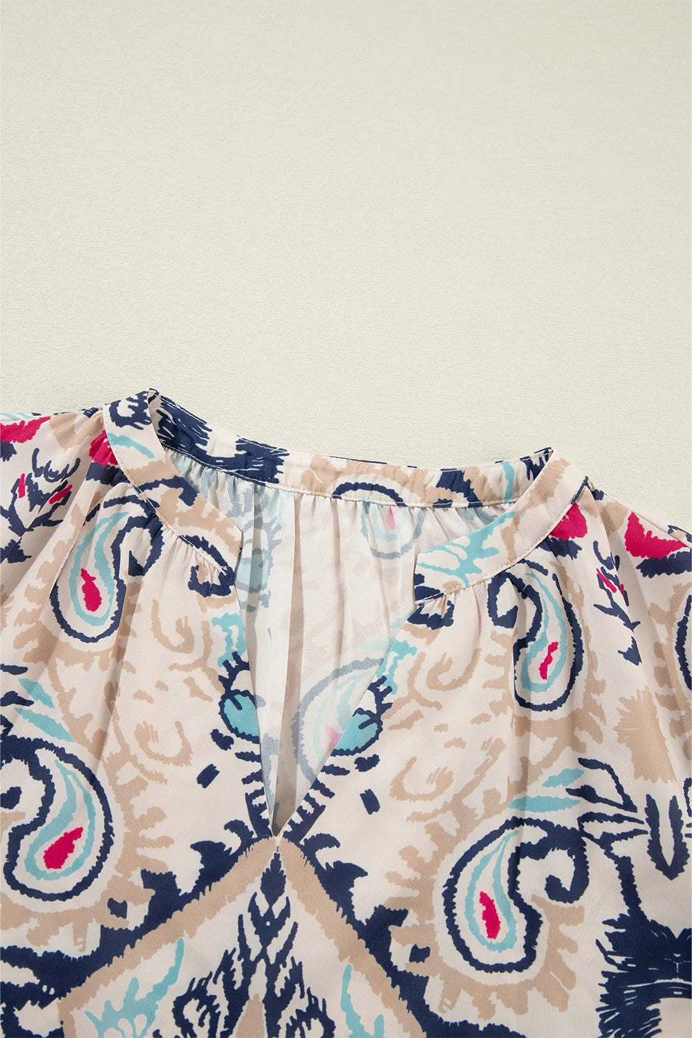 Printed Notched Half Sleeve Blouse.