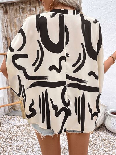 Perfee Printed Notched Half Sleeve Blouse.